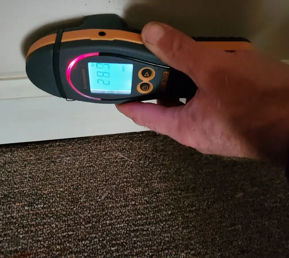 Moisture detection at baseboard during Storm Damage Restoration in Loomis